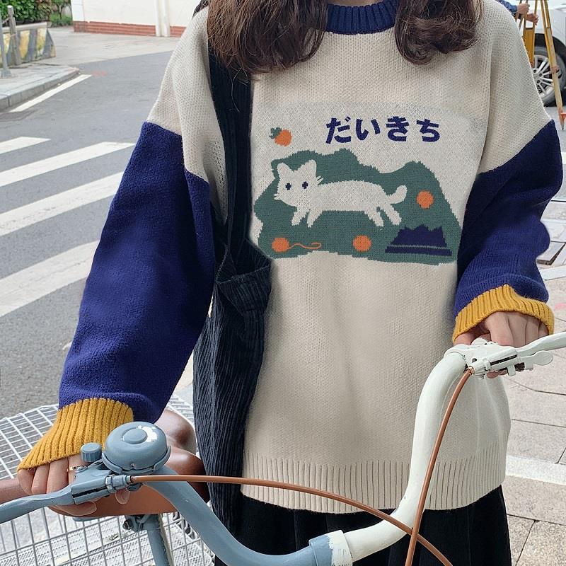a woman wearing a japanese style sweatshirt with cat design