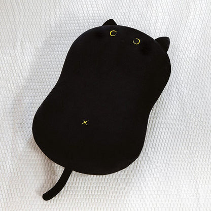 a black cat plush as a pillow