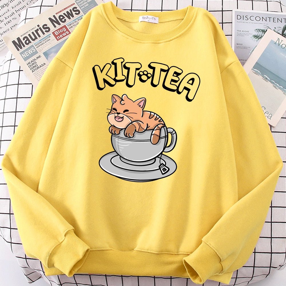 a yellow color cat print sweater with cat in a tea pot design
