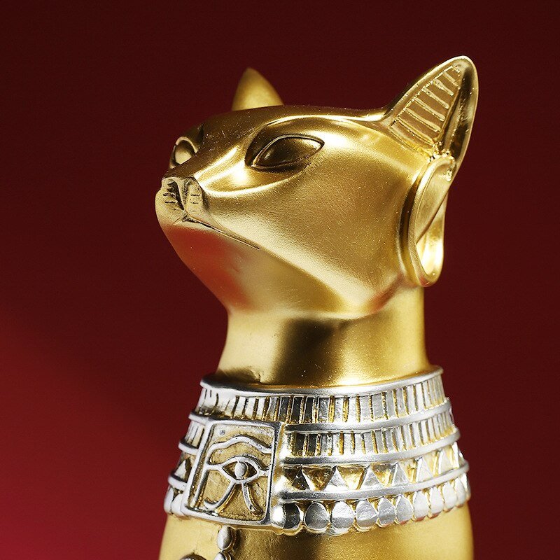 a close up of a cat sculptures with jewelry 