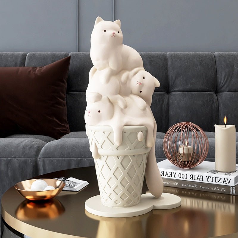a white color cat statue, featuring a melting ice cat on an ice cream cone, for artistic home decor