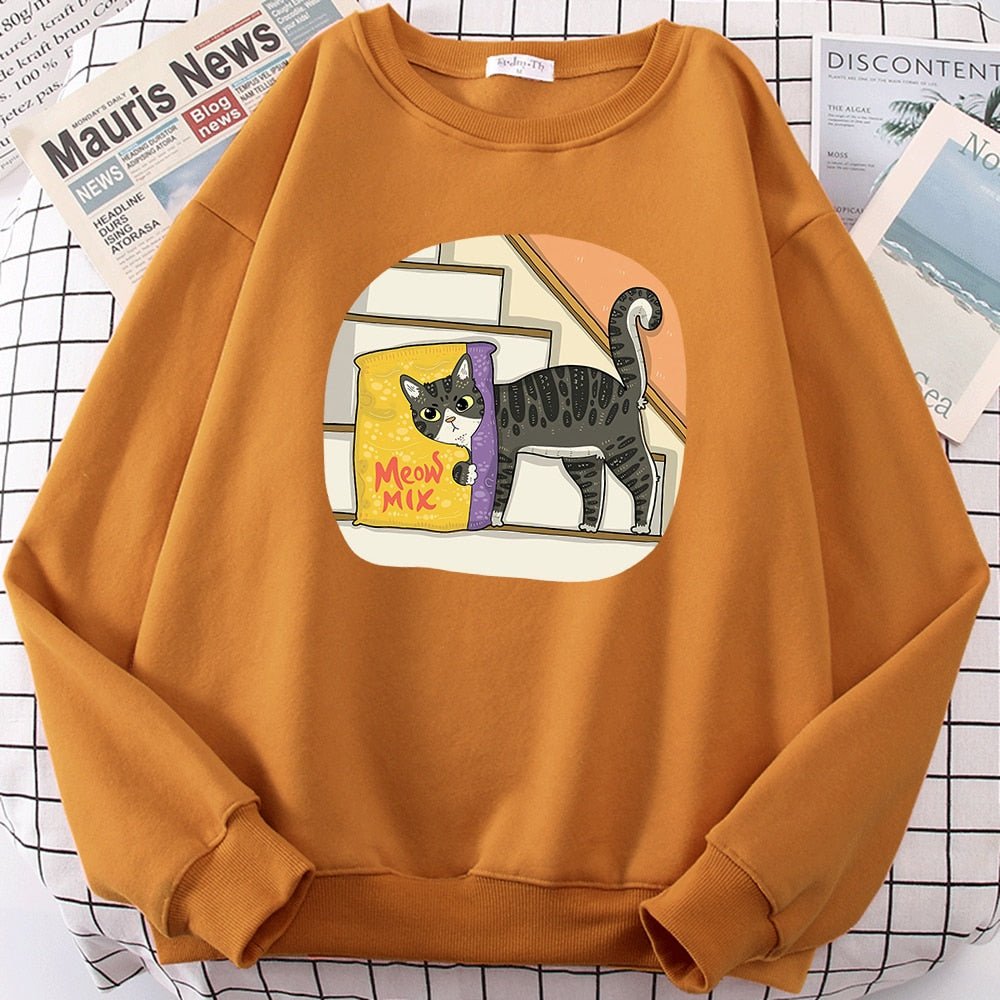 an orange color cute cat sweaters with a picture of a cat hiding behind cat food