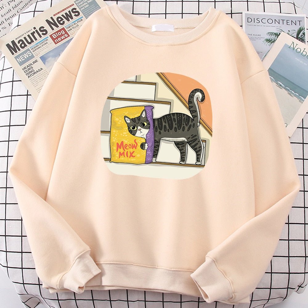 a beige color cat lover sweatshirt with a picture of a cat hiding behind cat food