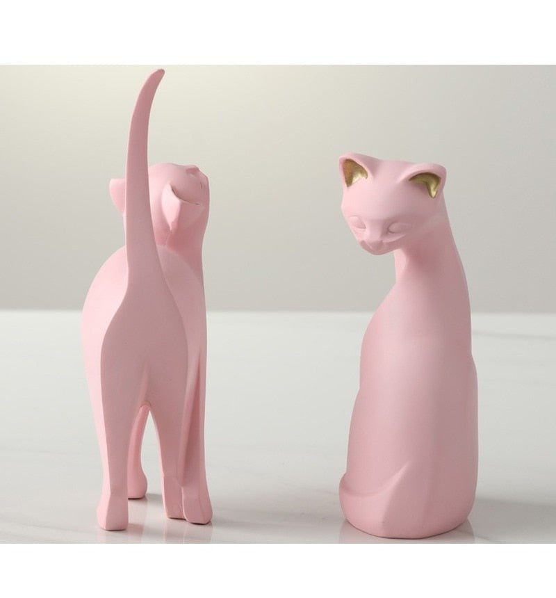 a set of cat statue in nordic pink color
