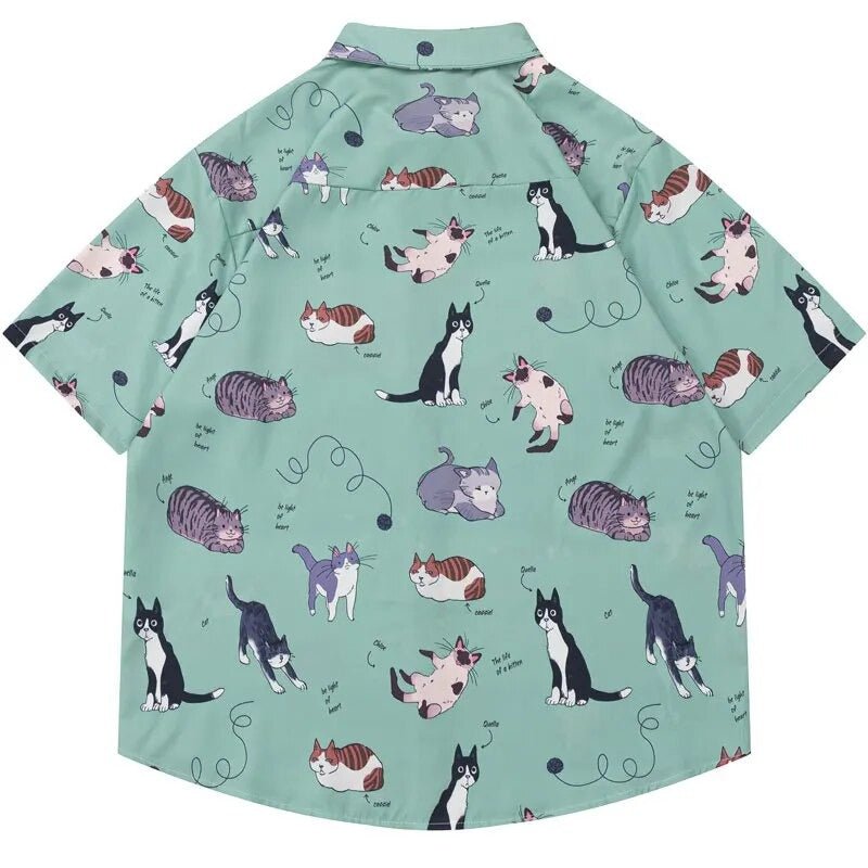 Buttoned-up shirt showcasing lazy cats and yarn motifs