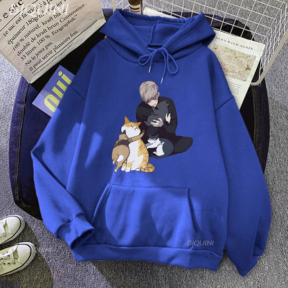blue color hoodie featuring a man and four cats cuddling
