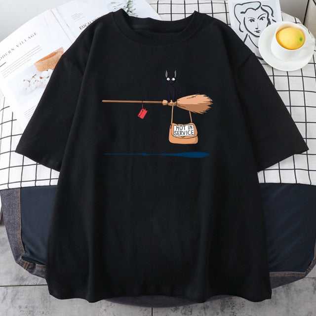 a black cat tee shirt featuring a black cat sitting on a broom with a bag written with not in service words