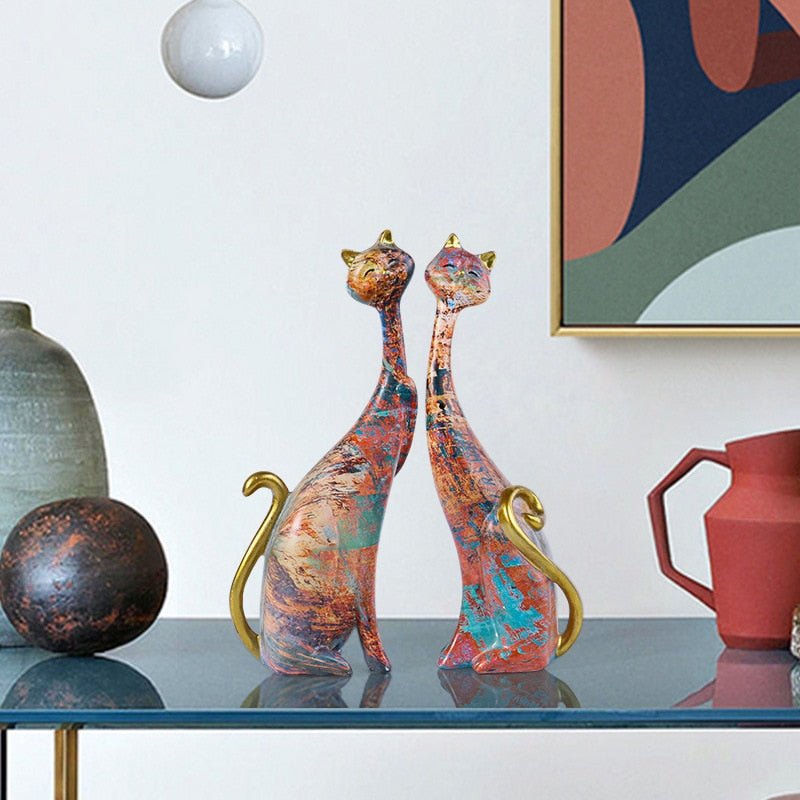 a home decor of a pair of cat figure with abstract design and color