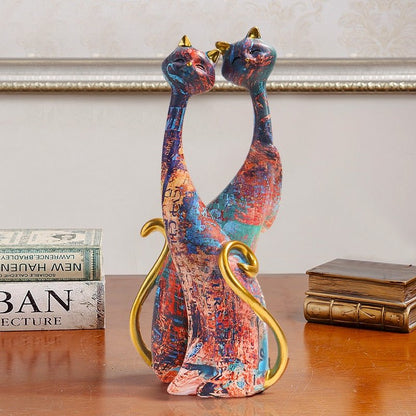 a pair of cat statue with golden base color and abstract design as a symbol of harmony at home 
