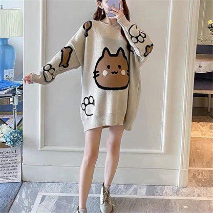 a lady wearing an oversized cat mom sweatshirt with cute cartoon