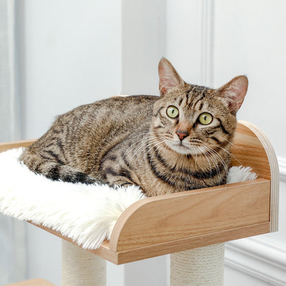 a cat resting on a platform of a cat tree