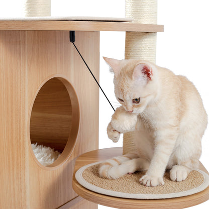 a cat playing with hanging ball from a boho cat tree