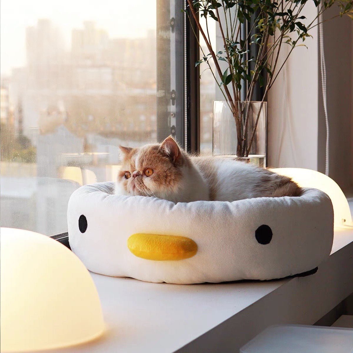 cat bed that is calming made for cats with an adorable penguin design