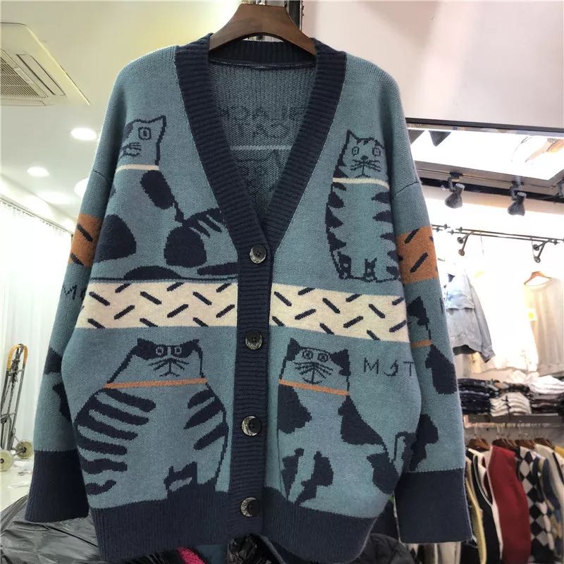 a blue woman cardigan with cats design