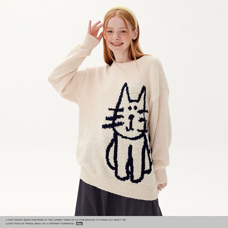 a lady wearing a white color cute cat sweater embroidered with a black cartoon cat