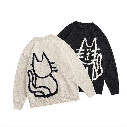 a couple matching sweatshirts with cats on them
