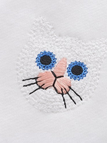 a close up of a cat pattern sweater