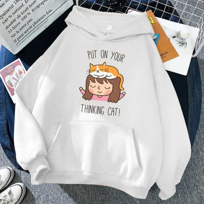 white color hoodie that looks adorable and cute featuring a girl and a cat on the girls head
