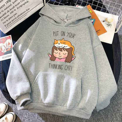 grey color cat hoodies made for men with a picture of a little girl and an orange cat playing with each other and a funny pun written on the hoodie