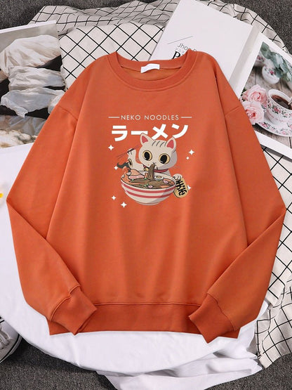 an orange color cat sweater for human with a picture of a cat eating ramen
