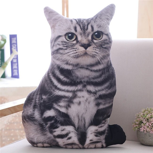 a realistic cat plush of a grey cat