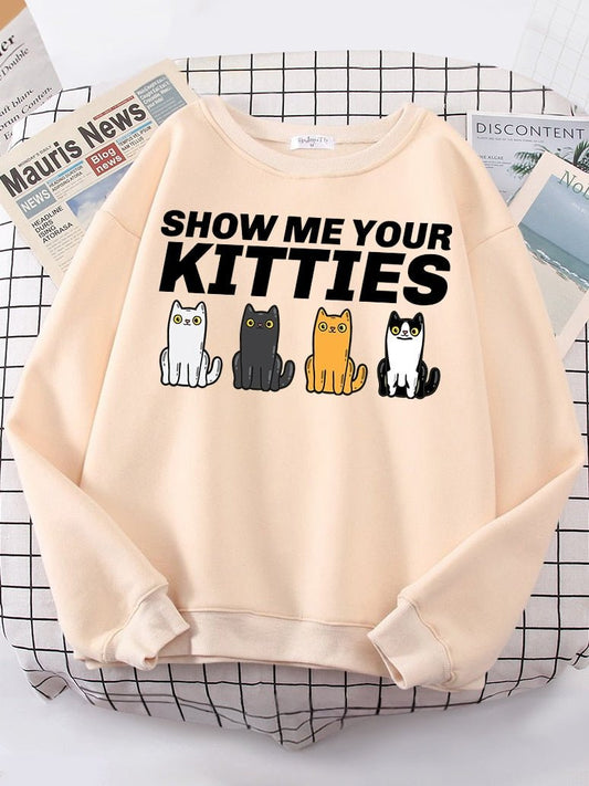 a beige color cat lover sweatshirt with cute cats and funny puns