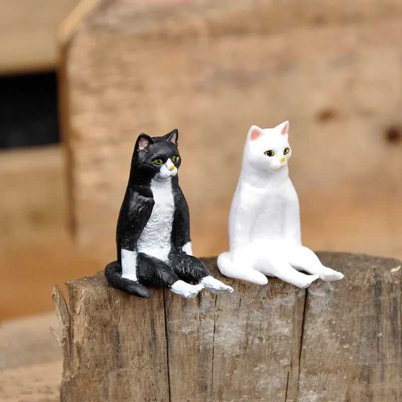 a white and black cat statue for home decor