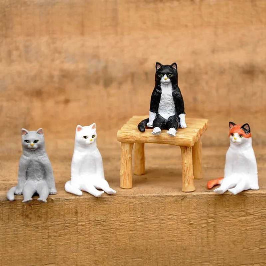a group of cat figure in a sitting position for home decor