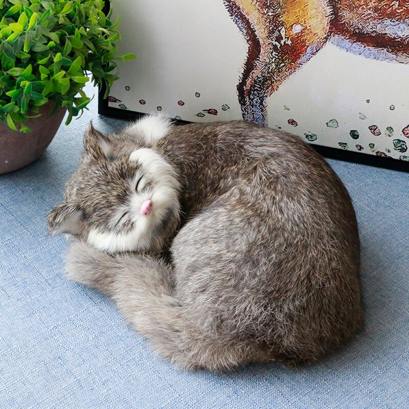 a real looking stuffed cats of a sleeping cat