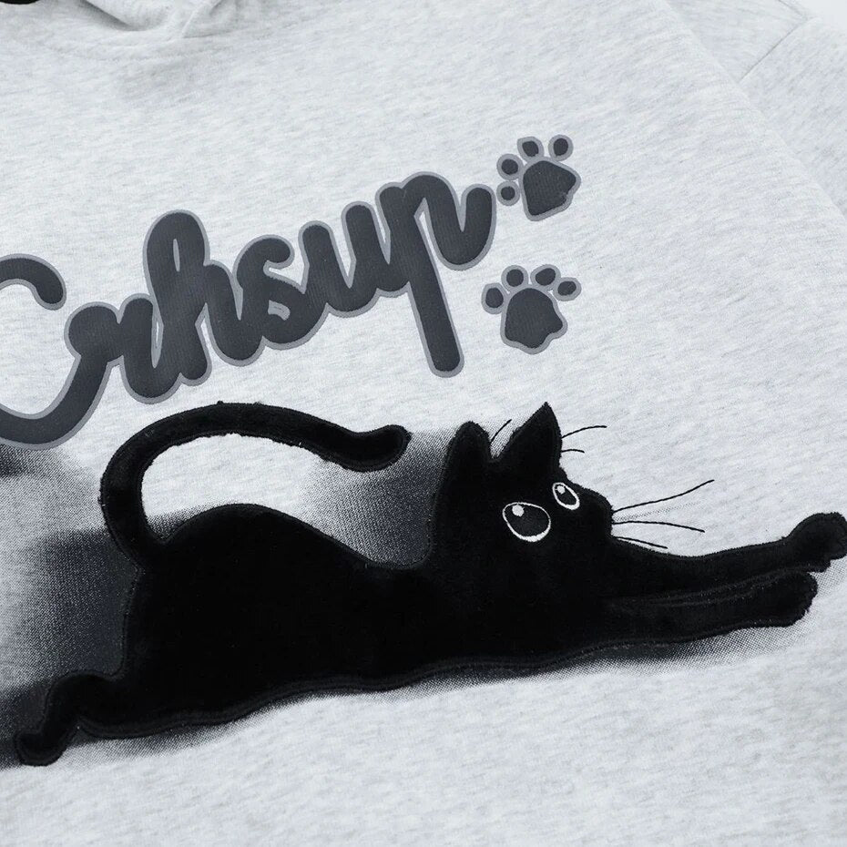 Fun and casual sliding cat graphic hoodie with paw detail