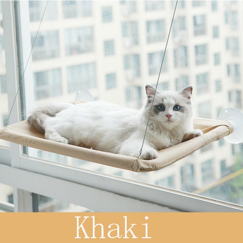 hammock style cat bed in khaki color that can be attached to windows 