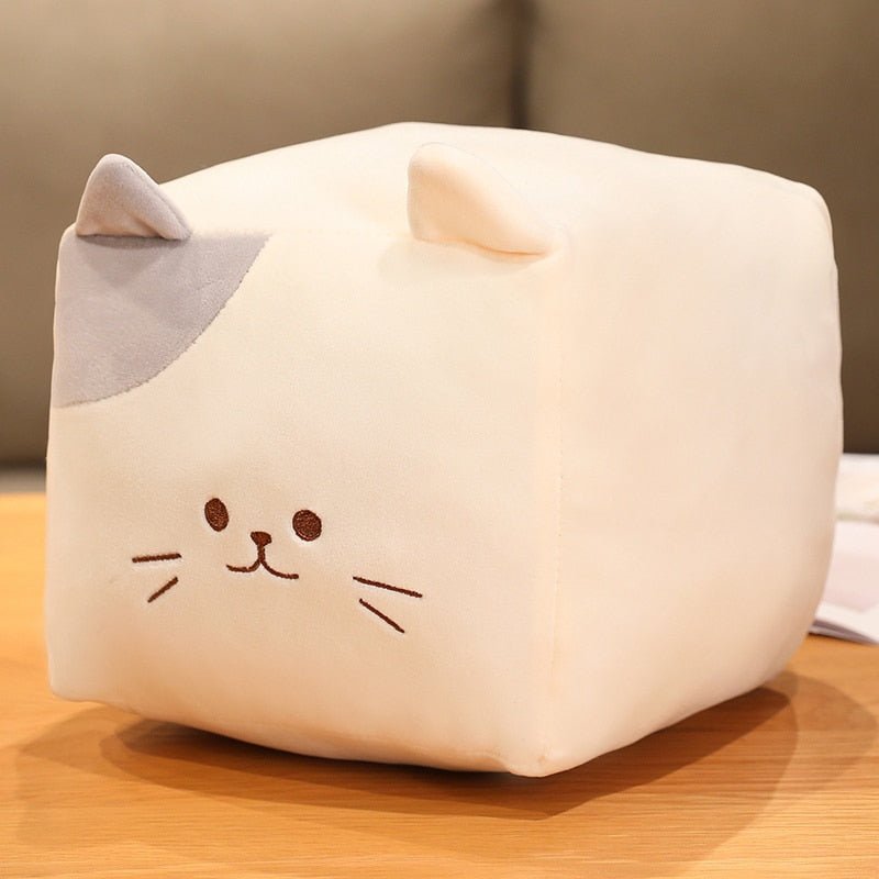 a white kawaii cat plushie in square shape