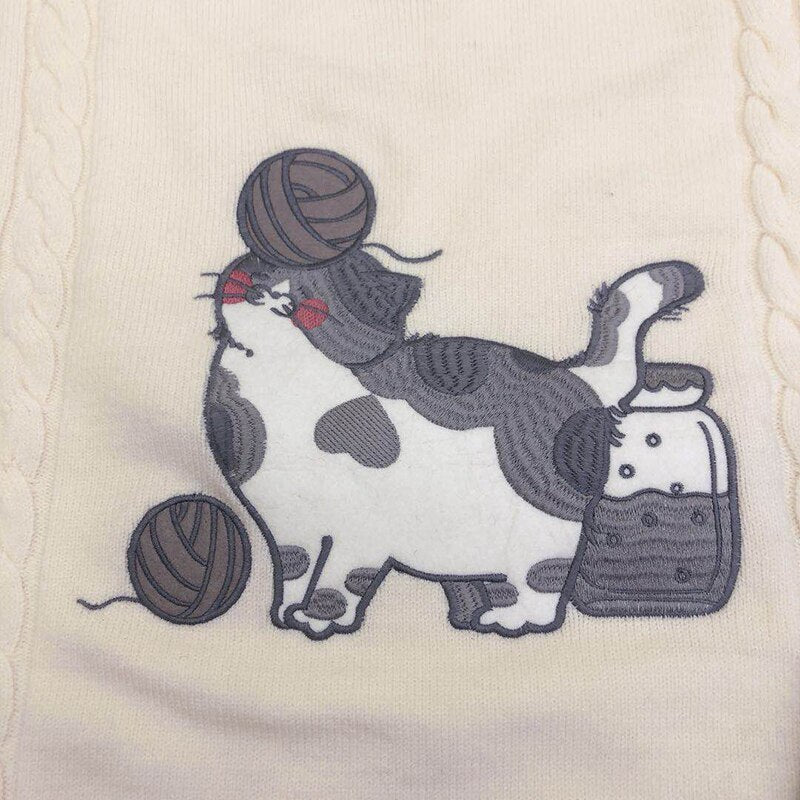 the embroidery cat and string ball on a cat mom sweatshirt