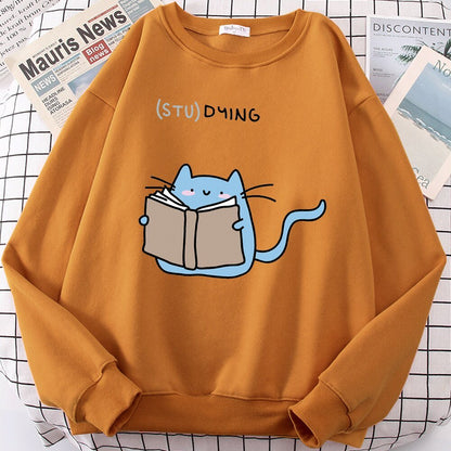 an orange color cute cat sweaters with a picture of a cat reading a book