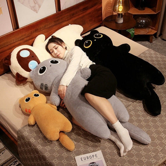 a woman cuddling with a long cat plush of different sizes
