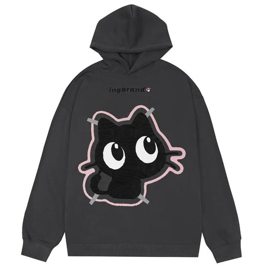 Hoodie design showcasing a cute wide-eyed black cat