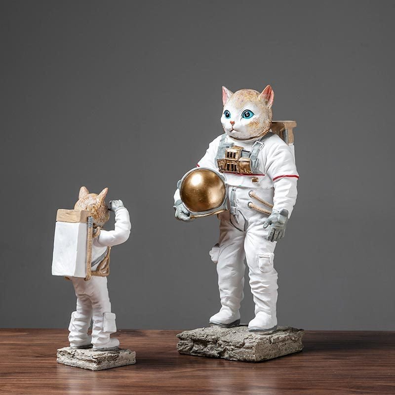 a set of cat sculpture of cats wearing complete asor home decortronaut suit f