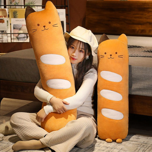 a woman hugging a pillow cat plush at the bedroom