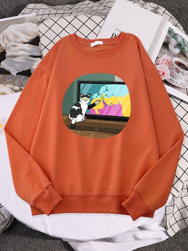 an orange cute cat sweatshirt with picture of cat doing broadcast show
