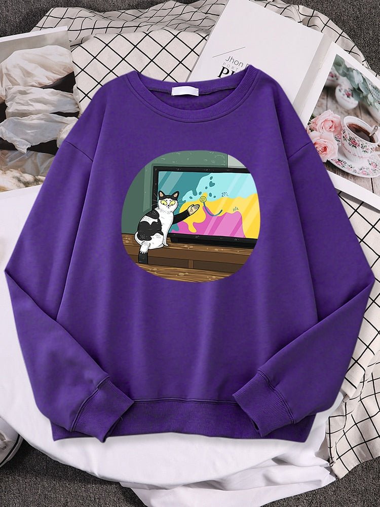 a purple color cat pattern sweater with picture of a cat giving a live broadcast