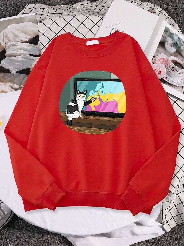 a red cute cat sweater with picture of a cat giving broadcast