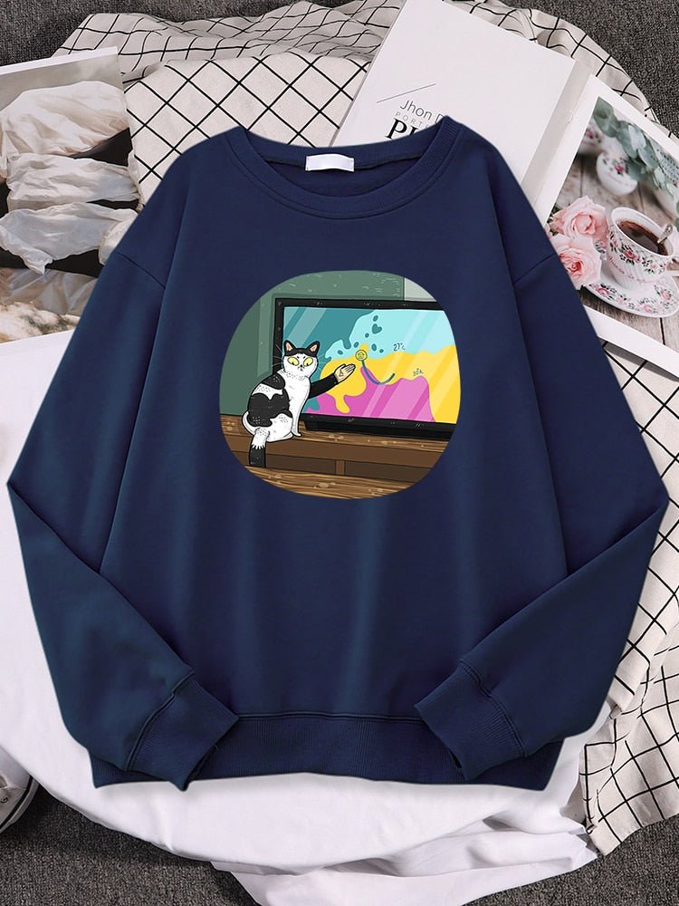a navy color cat sweatshirts for humans with a picture of cat doing broadcast show