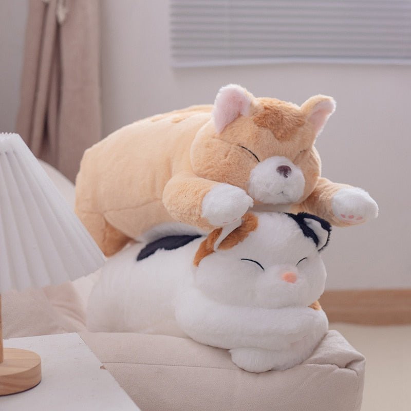cute cat plushies on top of each other