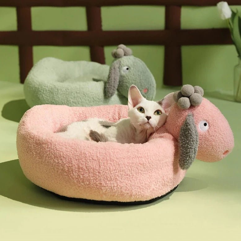 pink and green color bed for pets that comes with cushion and looks comfortable