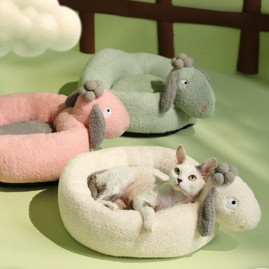 round shape cat bed with a cute sheep design that is made from wool in multiple colors