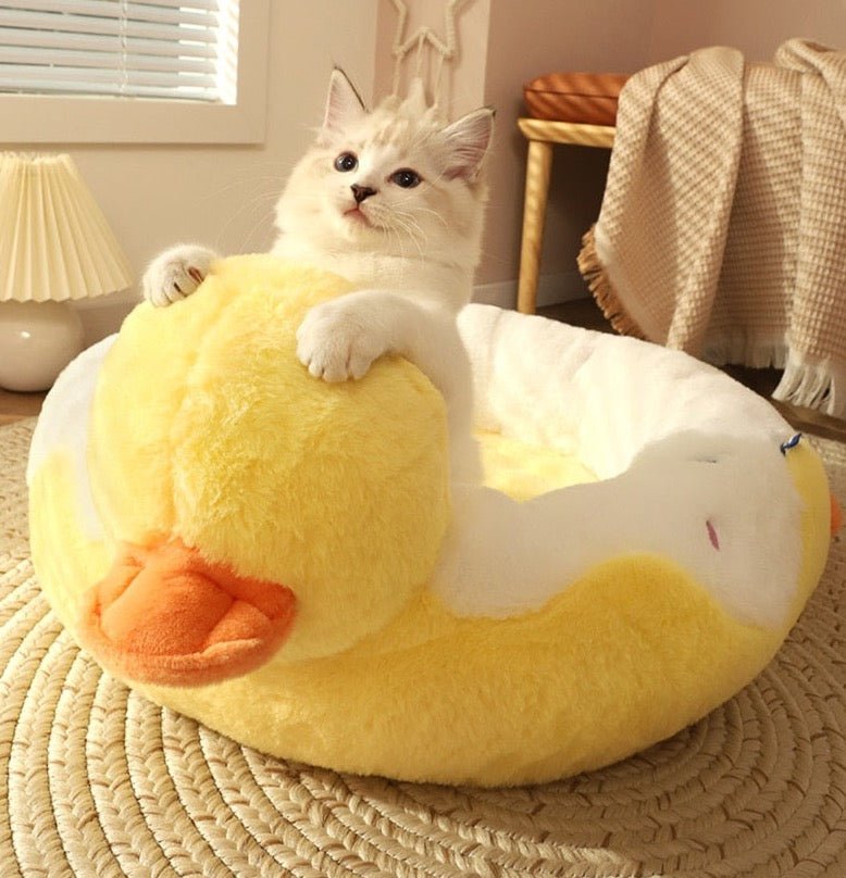 yellow duck cat bed that looks like a float