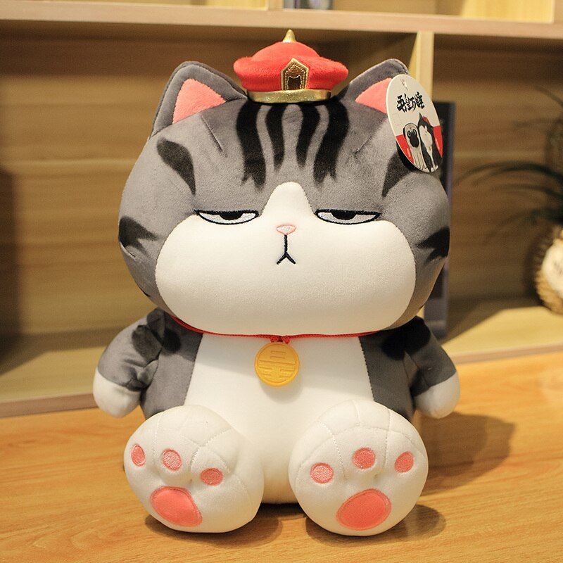 a royal cat plushie sitting on a table