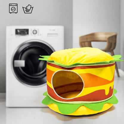 funny looking cat bed that looks like a fast food burger with an enclosed space 