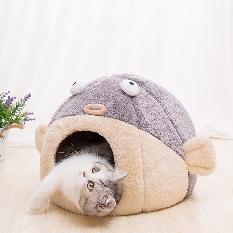 cute looking cat bed with a big fish design that creates the illusion of fish eating which looks adorable