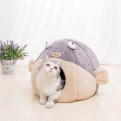 enclosed bed in a fat fist design made for pet cat that looks unique and adorable